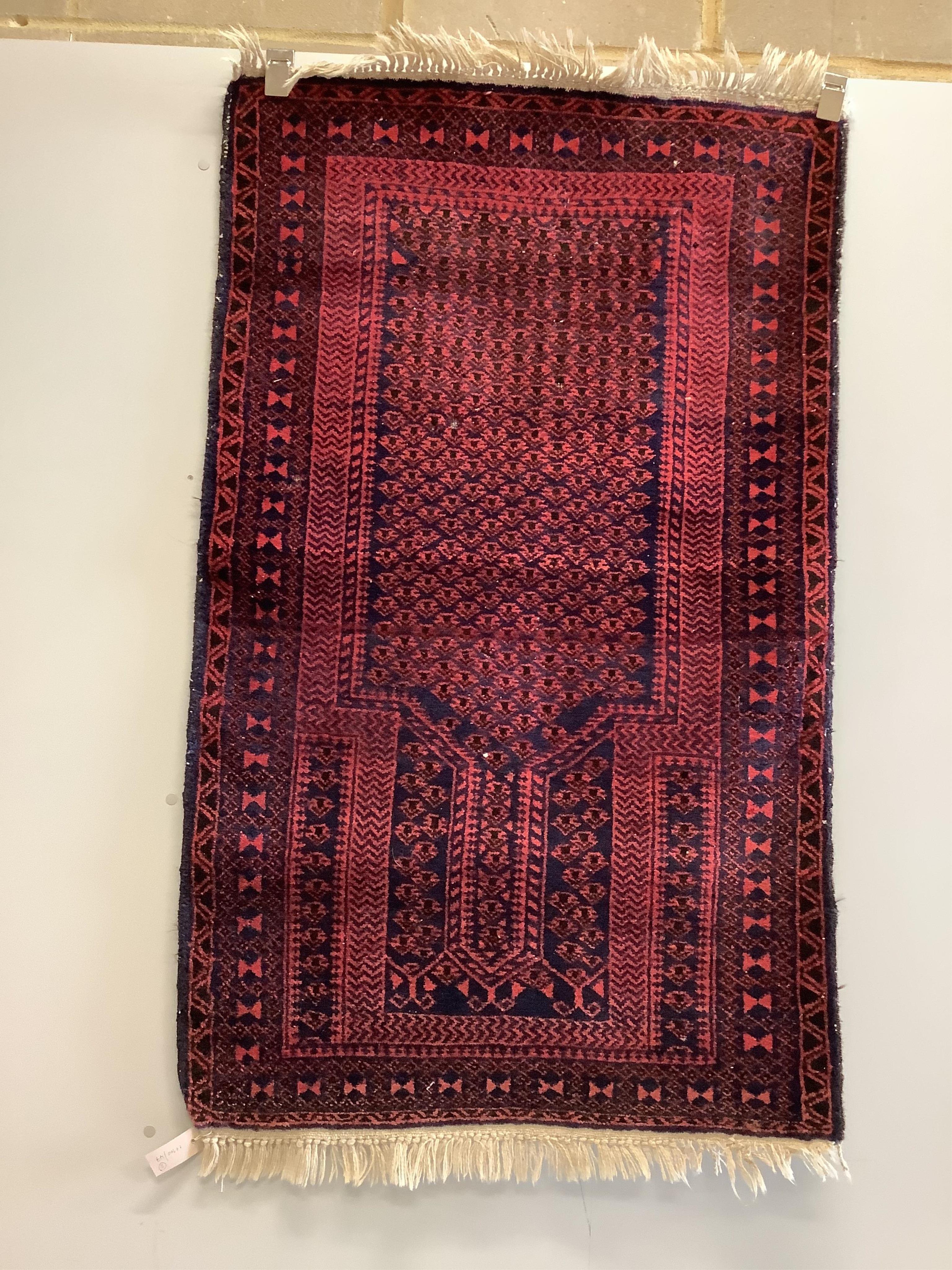 A Belouch prayer rug and an Afghan rug, larger 136 x 87cm. Condition - fair